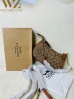 COACH  6603 𝐏𝐫𝐞𝐦𝐢𝐮𝐦 𝐋𝐚𝐝𝐢𝐞𝐬 𝐁𝐚𝐠 ⚡️  ✨ 𝐄𝐥𝐞𝐯𝐚𝐭𝐞 𝐲𝐨𝐮𝐫 𝐬𝐭𝐲𝐥𝐞 𝐰𝐢𝐭𝐡 𝐨𝐮𝐫 𝐏𝐫𝐞𝐦𝐢𝐮𝐦 𝐋𝐚𝐝𝐢𝐞𝐬 𝐁𝐚𝐠𝐬! 💫𝐂𝐫𝐚𝐟𝐭𝐞𝐝 𝐰𝐢𝐭𝐡 𝐞𝐥𝐞𝐠𝐚𝐧𝐜𝐞 𝐚𝐧𝐝 𝐝𝐞𝐬𝐢𝐠𝐧𝐞𝐝 𝐟𝐨𝐫 𝐭𝐡𝐞 𝐦𝐨𝐝𝐞𝐫𝐧 𝐰𝐨𝐦𝐚𝐧, 𝐭𝐡𝐞𝐬𝐞 𝐛𝐚𝐠𝐬 𝐚𝐫𝐞 𝐭𝐡𝐞 𝐩𝐞𝐫𝐟𝐞𝐜𝐭 𝐛𝐥𝐞𝐧𝐝 𝐨𝐟 𝐥𝐮𝐱𝐮𝐫𝐲 𝐚𝐧𝐝 𝐟𝐮𝐧𝐜𝐭𝐢𝐨𝐧𝐚𝐥𝐢𝐭𝐲. 𝐂𝐚𝐫𝐫𝐲 𝐲𝐨𝐮𝐫 𝐞𝐬𝐬𝐞𝐧𝐭𝐢𝐚𝐥𝐬 𝐢𝐧 𝐬𝐭𝐲𝐥𝐞 𝐰𝐡𝐞𝐫𝐞𝐯𝐞𝐫 𝐲𝐨𝐮 𝐠𝐨! 🌟  * Imported products. * Quality Controlled (QC )Finishing. * Very Own Unique Design. - Image 6