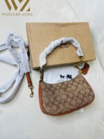 COACH  6603 𝐏𝐫𝐞𝐦𝐢𝐮𝐦 𝐋𝐚𝐝𝐢𝐞𝐬 𝐁𝐚𝐠 ⚡️  ✨ 𝐄𝐥𝐞𝐯𝐚𝐭𝐞 𝐲𝐨𝐮𝐫 𝐬𝐭𝐲𝐥𝐞 𝐰𝐢𝐭𝐡 𝐨𝐮𝐫 𝐏𝐫𝐞𝐦𝐢𝐮𝐦 𝐋𝐚𝐝𝐢𝐞𝐬 𝐁𝐚𝐠𝐬! 💫𝐂𝐫𝐚𝐟𝐭𝐞𝐝 𝐰𝐢𝐭𝐡 𝐞𝐥𝐞𝐠𝐚𝐧𝐜𝐞 𝐚𝐧𝐝 𝐝𝐞𝐬𝐢𝐠𝐧𝐞𝐝 𝐟𝐨𝐫 𝐭𝐡𝐞 𝐦𝐨𝐝𝐞𝐫𝐧 𝐰𝐨𝐦𝐚𝐧, 𝐭𝐡𝐞𝐬𝐞 𝐛𝐚𝐠𝐬 𝐚𝐫𝐞 𝐭𝐡𝐞 𝐩𝐞𝐫𝐟𝐞𝐜𝐭 𝐛𝐥𝐞𝐧𝐝 𝐨𝐟 𝐥𝐮𝐱𝐮𝐫𝐲 𝐚𝐧𝐝 𝐟𝐮𝐧𝐜𝐭𝐢𝐨𝐧𝐚𝐥𝐢𝐭𝐲. 𝐂𝐚𝐫𝐫𝐲 𝐲𝐨𝐮𝐫 𝐞𝐬𝐬𝐞𝐧𝐭𝐢𝐚𝐥𝐬 𝐢𝐧 𝐬𝐭𝐲𝐥𝐞 𝐰𝐡𝐞𝐫𝐞𝐯𝐞𝐫 𝐲𝐨𝐮 𝐠𝐨! 🌟  * Imported products. * Quality Controlled (QC )Finishing. * Very Own Unique Design. - Image 7