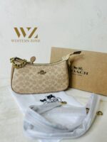 COACH  6603 𝐏𝐫𝐞𝐦𝐢𝐮𝐦 𝐋𝐚𝐝𝐢𝐞𝐬 𝐁𝐚𝐠 ⚡️  ✨ 𝐄𝐥𝐞𝐯𝐚𝐭𝐞 𝐲𝐨𝐮𝐫 𝐬𝐭𝐲𝐥𝐞 𝐰𝐢𝐭𝐡 𝐨𝐮𝐫 𝐏𝐫𝐞𝐦𝐢𝐮𝐦 𝐋𝐚𝐝𝐢𝐞𝐬 𝐁𝐚𝐠𝐬! 💫𝐂𝐫𝐚𝐟𝐭𝐞𝐝 𝐰𝐢𝐭𝐡 𝐞𝐥𝐞𝐠𝐚𝐧𝐜𝐞 𝐚𝐧𝐝 𝐝𝐞𝐬𝐢𝐠𝐧𝐞𝐝 𝐟𝐨𝐫 𝐭𝐡𝐞 𝐦𝐨𝐝𝐞𝐫𝐧 𝐰𝐨𝐦𝐚𝐧, 𝐭𝐡𝐞𝐬𝐞 𝐛𝐚𝐠𝐬 𝐚𝐫𝐞 𝐭𝐡𝐞 𝐩𝐞𝐫𝐟𝐞𝐜𝐭 𝐛𝐥𝐞𝐧𝐝 𝐨𝐟 𝐥𝐮𝐱𝐮𝐫𝐲 𝐚𝐧𝐝 𝐟𝐮𝐧𝐜𝐭𝐢𝐨𝐧𝐚𝐥𝐢𝐭𝐲. 𝐂𝐚𝐫𝐫𝐲 𝐲𝐨𝐮𝐫 𝐞𝐬𝐬𝐞𝐧𝐭𝐢𝐚𝐥𝐬 𝐢𝐧 𝐬𝐭𝐲𝐥𝐞 𝐰𝐡𝐞𝐫𝐞𝐯𝐞𝐫 𝐲𝐨𝐮 𝐠𝐨! 🌟  * Imported products. * Quality Controlled (QC )Finishing. * Very Own Unique Design. - Image 12